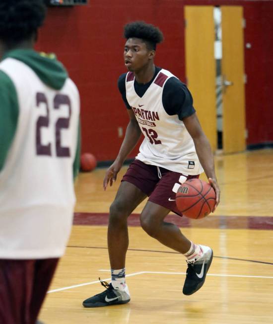 Cimarron-Memorial’s Brian Washington runs the court during teams practice at their sch ...