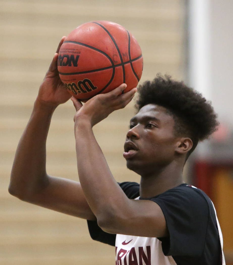 Cimarron-Memorial’s Brian Washington prepares to shoot during teams practice at their ...