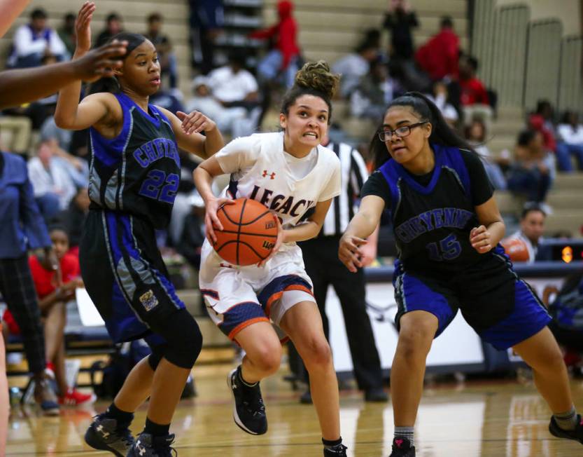 Legacy’s Rory Carter (23) drives to the basket against Cheyenne’s Brielle Jeffer ...