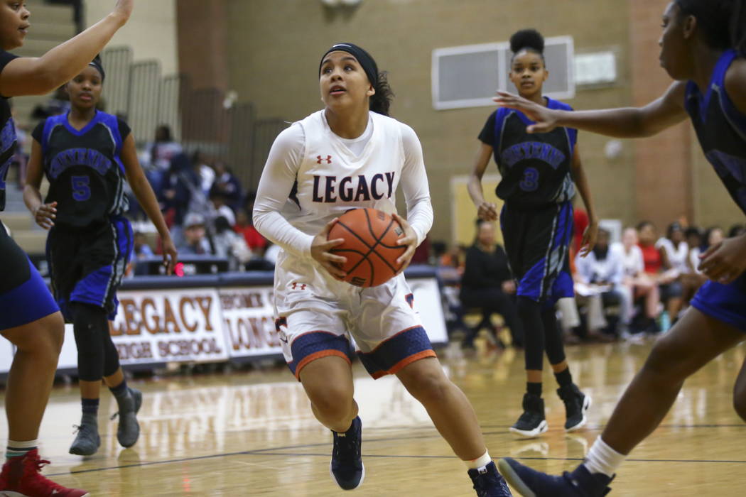 Legacy’s Taeha Pankey (3) drives to the basket against Cheyenne during a basketball ga ...