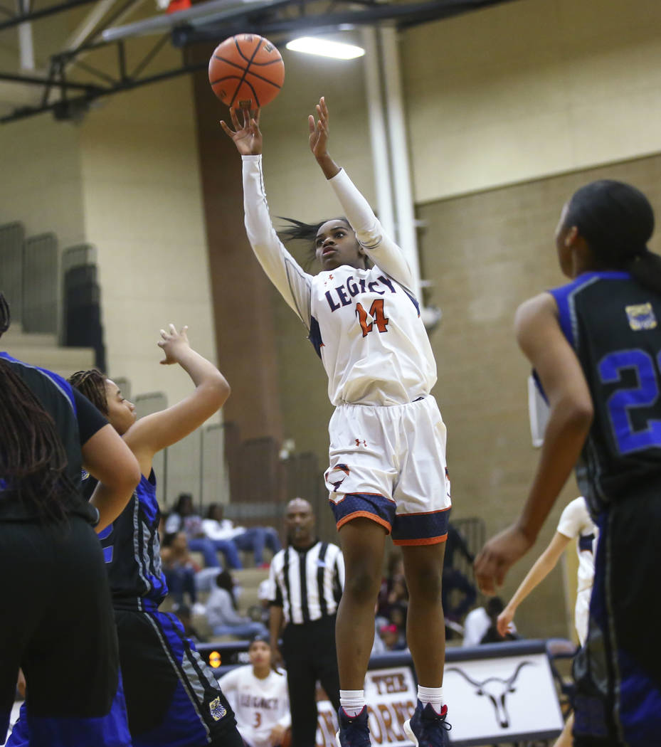 Legacy’s Maiah Yearwood (24) goes up to shoot against Cheyenne during a basketball gam ...