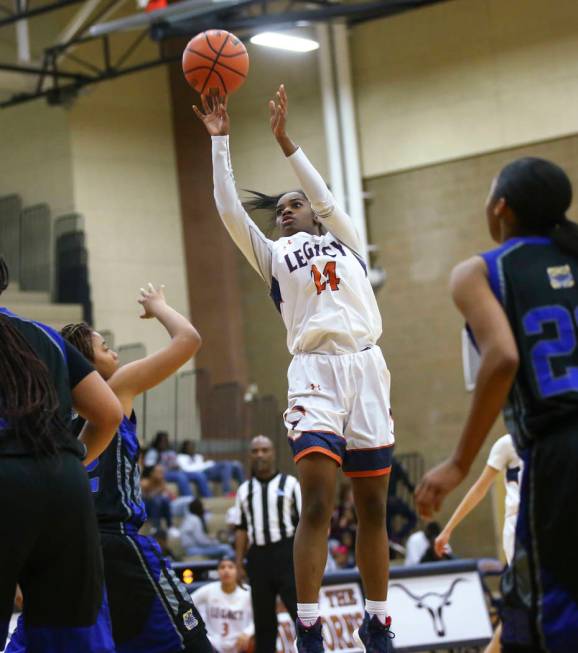 Legacy’s Maiah Yearwood (24) goes up to shoot against Cheyenne during a basketball gam ...