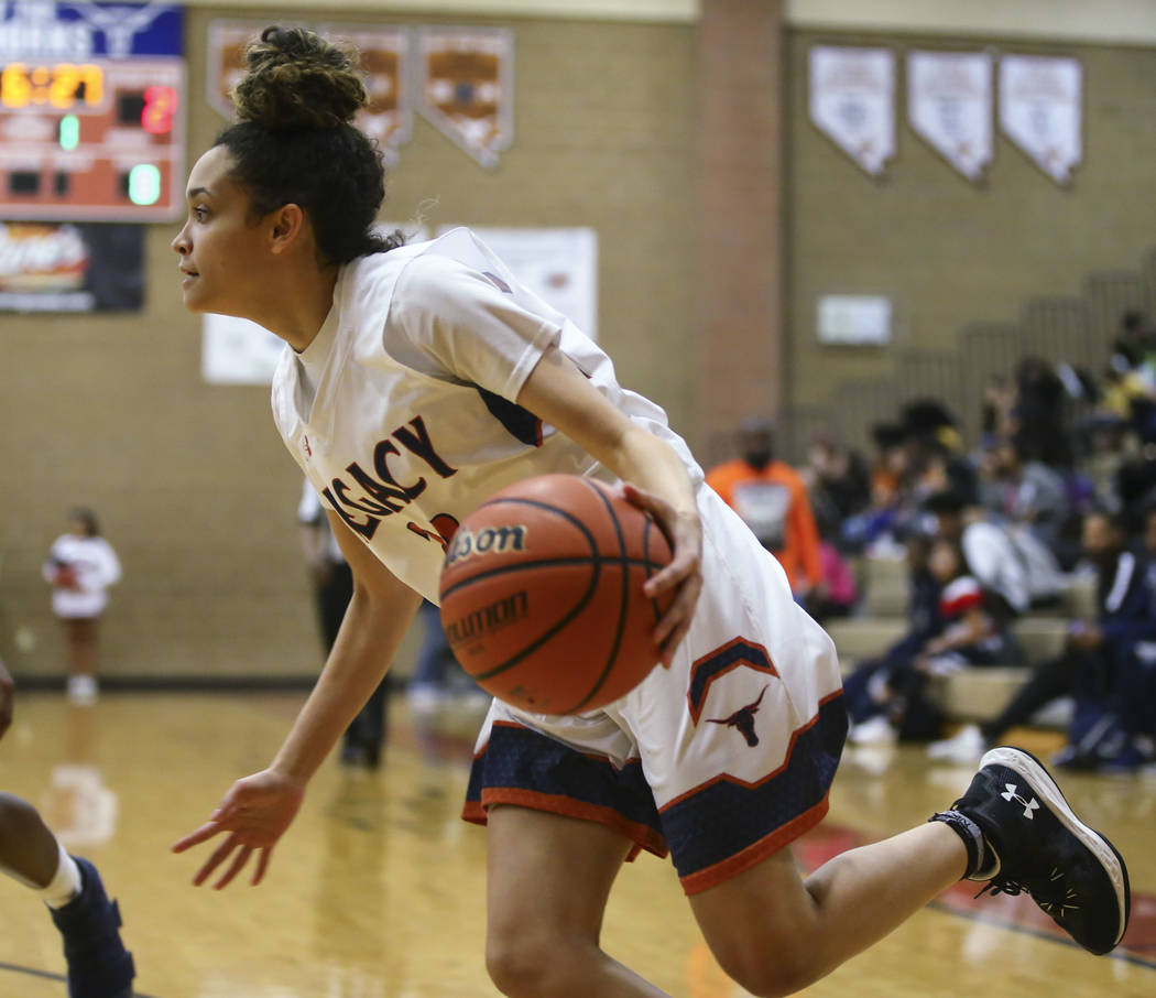 Legacy’s Rory Carter (23) drives against Cheyenne during a basketball game at Legacy H ...