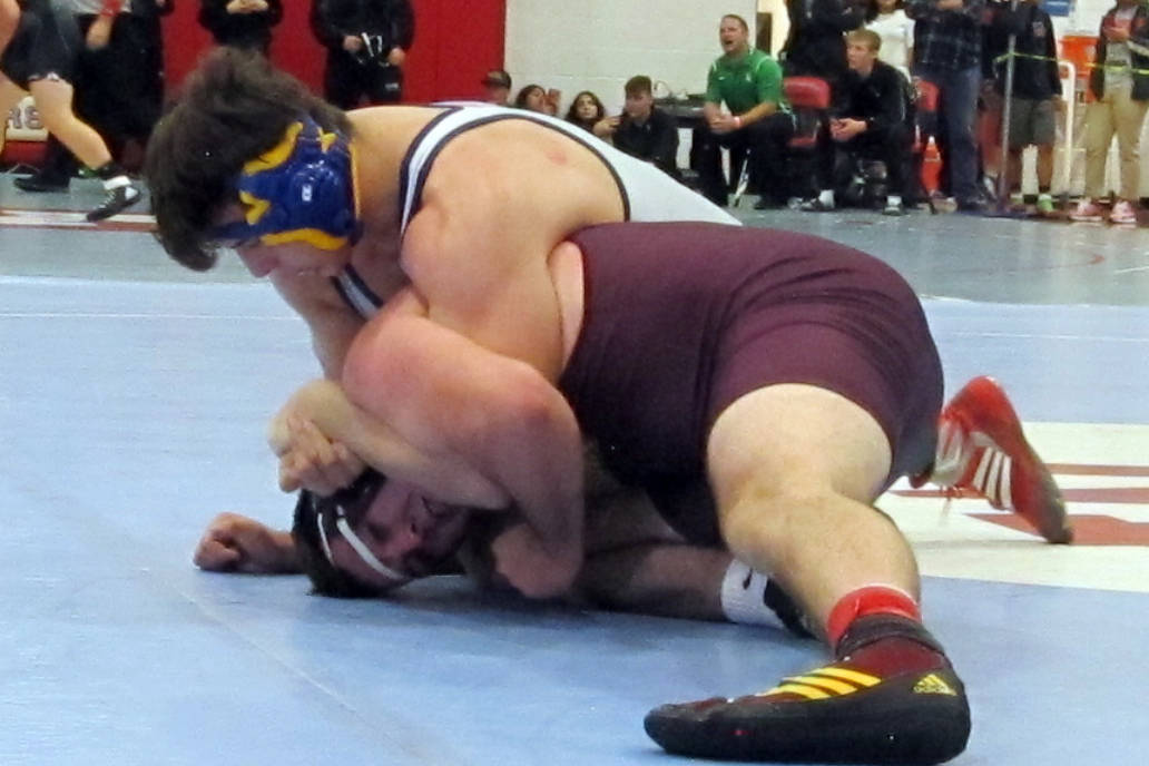 Ryan Vanario of Boulder City, top, grapples with Jeremy Albertson of Pahrump Valley in a qua ...