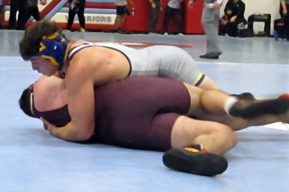 Ryan Vanario of Boulder City, top, grapples with Jeremy Albertson of Pahrump Valley in a qua ...