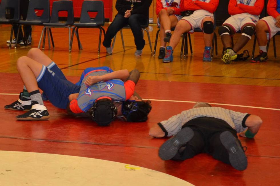 Valley 145-pounder Xzavier Maheia pins his first round opponent, Canyon Springs’ Rober ...