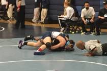 Centennial wrestler Richard Kilgore pins his opponent in the quarterfinals of the Sunset Reg ...