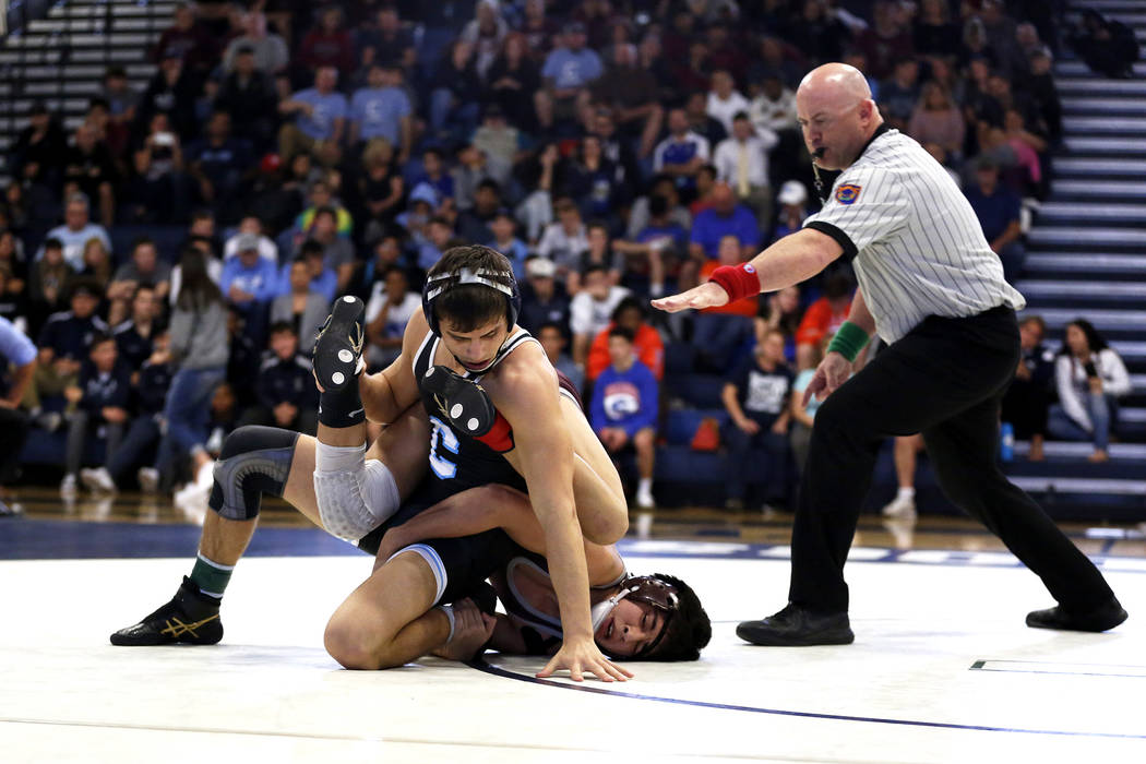 Nico Antuna, of Centennial High School, left, wrestles Daniel Rodriguez, of Cimarron-Memoria ...