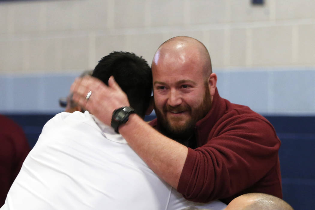 John Brokish, assistant coach for Cimarron-Memorial High School, celebrates his school&#8217 ...