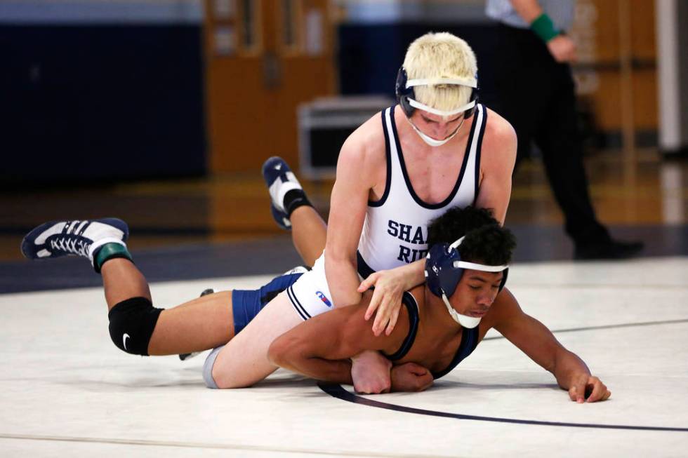 Weston Presser, of Shadow Ridge High School, pins Michael Canada, of Spring Valley High Scho ...