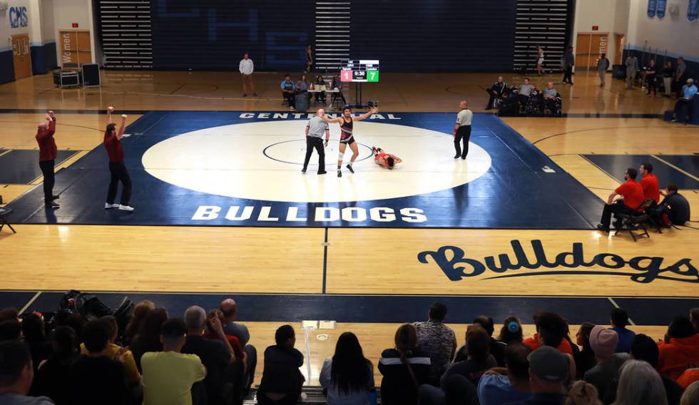 Amado Castellon, of Cimarron-Memorial High School, cheers after defeating Nathan Egbalic, of ...