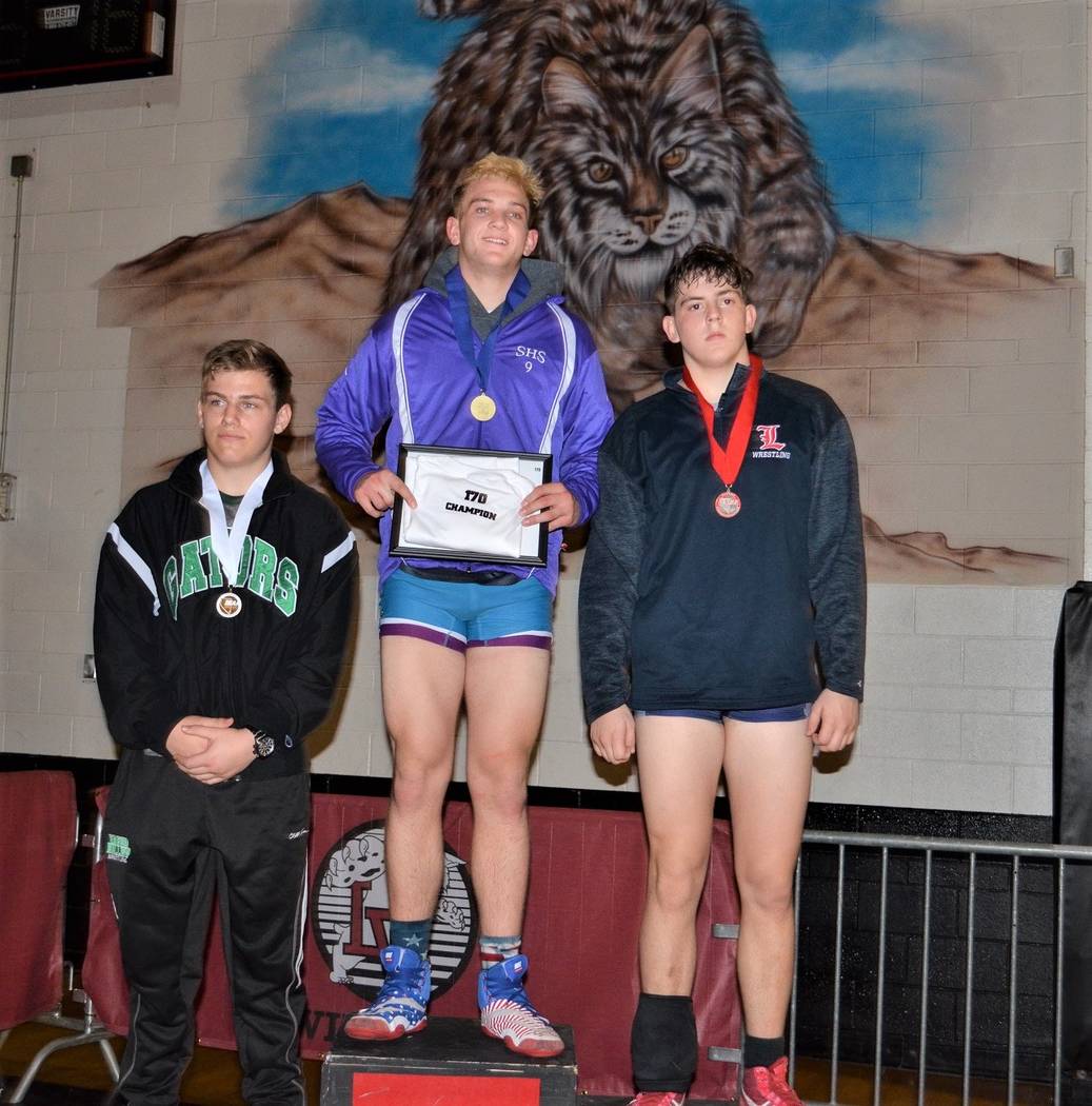 Silverado’s Brandon Paris (center) defeated Liberty’s Jake Whiddon (right) in th ...