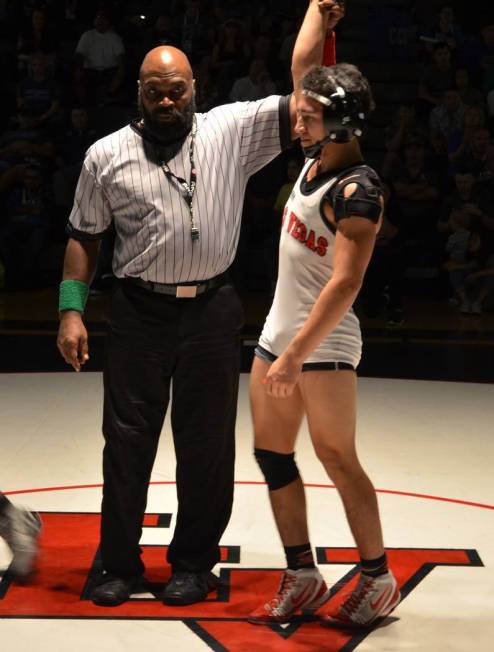 Referee Gordon Washington raises the hand of Las Vegas’ Antonio Saldate who won the 12 ...