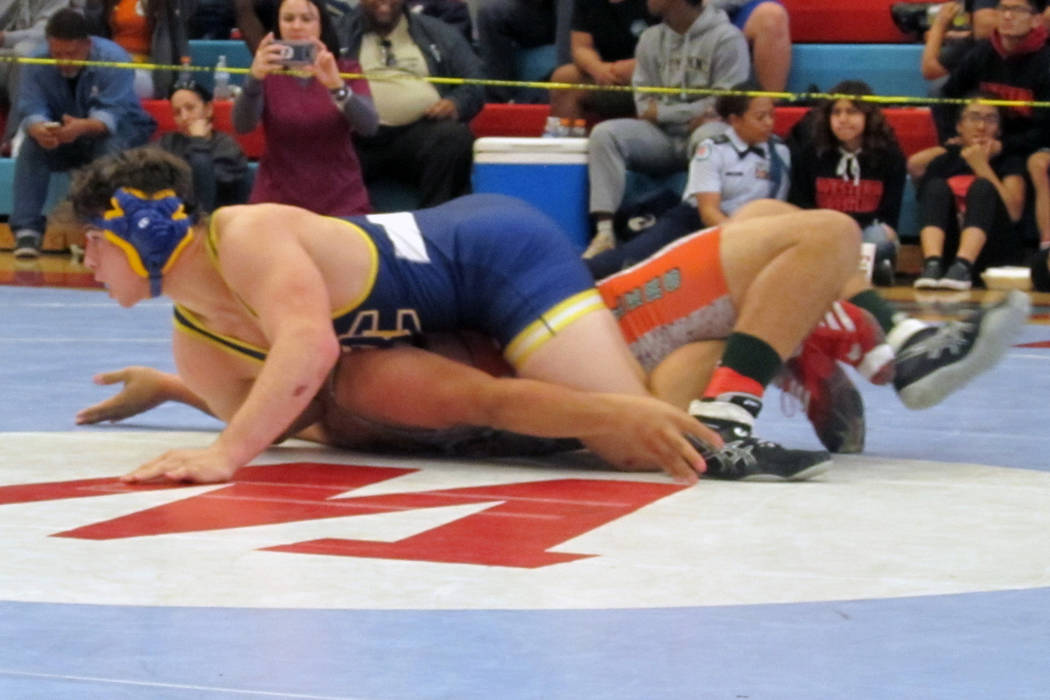 Ryan Vanario of Boulder City, top, wrestles Sergio Salaza of Mojave in the 195-pound champio ...