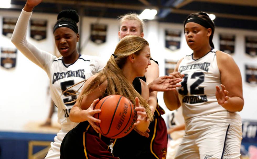 Pahrump Valley’s Skyler Lauver (4) tries to defend the ball from Cheyenne High during ...