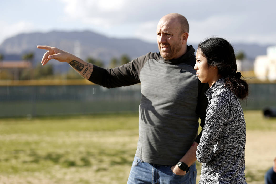 Tiarra Del Rosario, one of the best flag football players in the state, talks to head coach ...