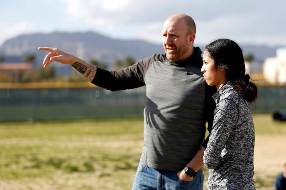 Tiarra Del Rosario, one of the best flag football players in the state, talks to head coach ...