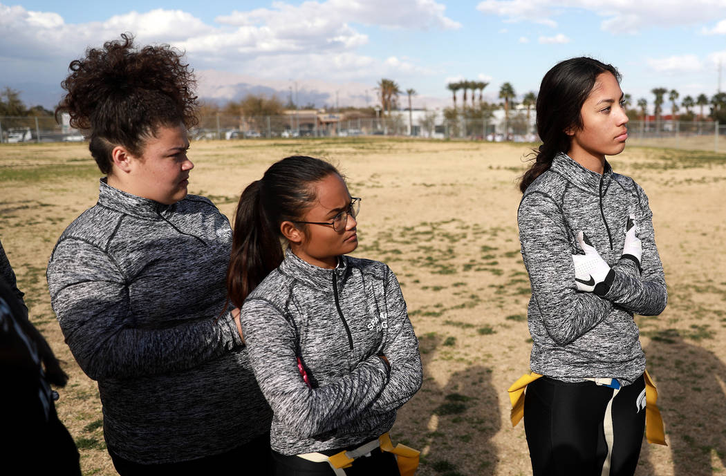 Tiarra Del Rosario, one of the best flag football players in the state, Tesha Houpe, left, a ...