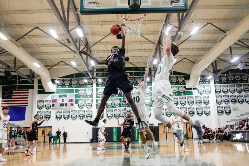 Cimarron-Memorial’s Brian Washington (32) gets a rebound during the fourth quarter of ...