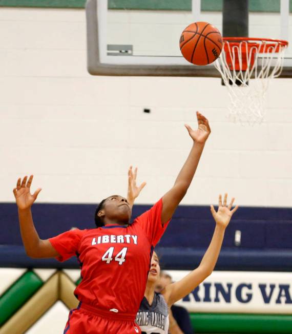 Liberty High’s Dre’una Edwards (44) shoots against Spring Valley during a girl&# ...