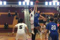 Needles and Lake Mead boys basketball players at the opening tip-off of their Class 2A South ...