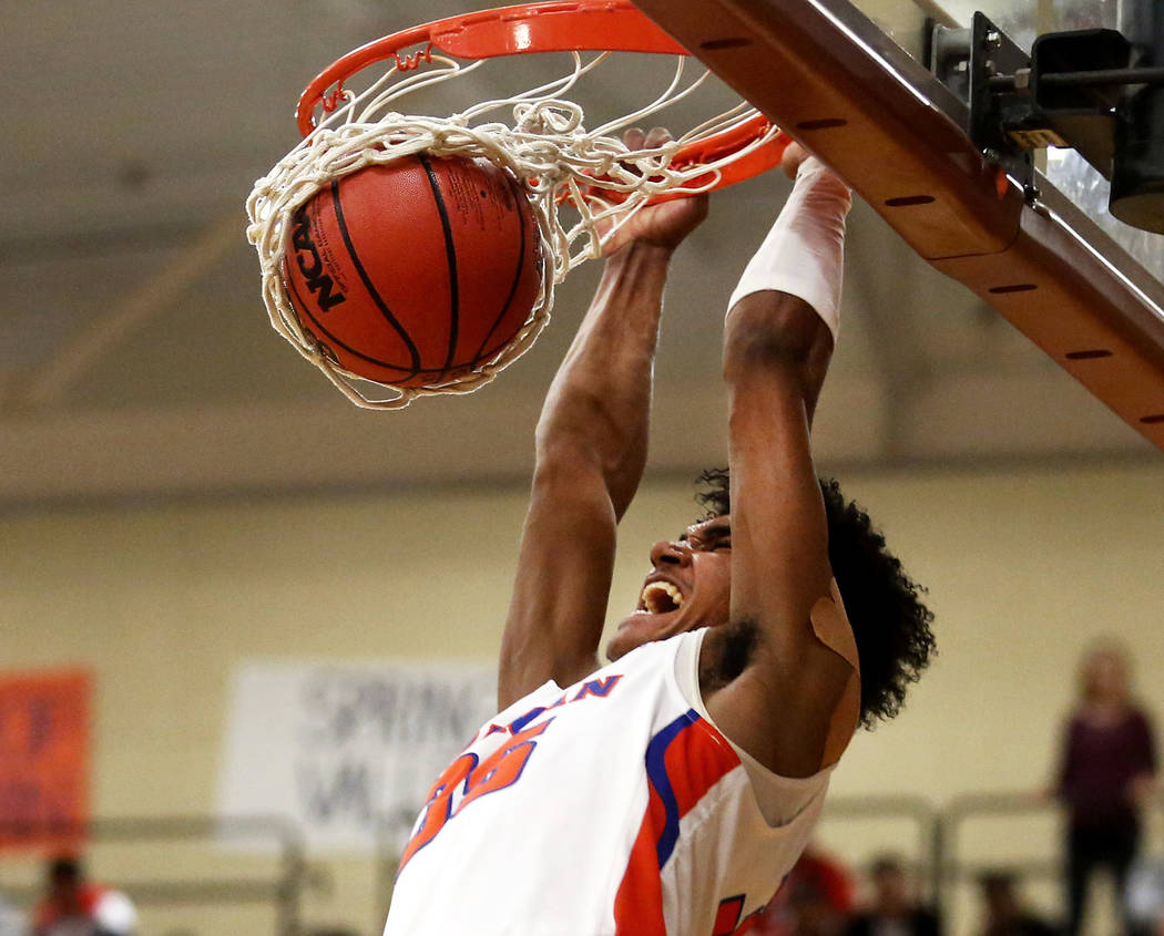 Bishop Gorman’s Jamal Bey (35) dunks the ball against Clark during the Sunset Region b ...