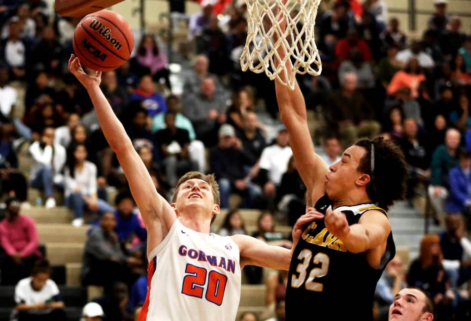 Bishop Gorman’s Noah Taitz (20) shoots against Clark’s Ian Alexander (32) durin ...