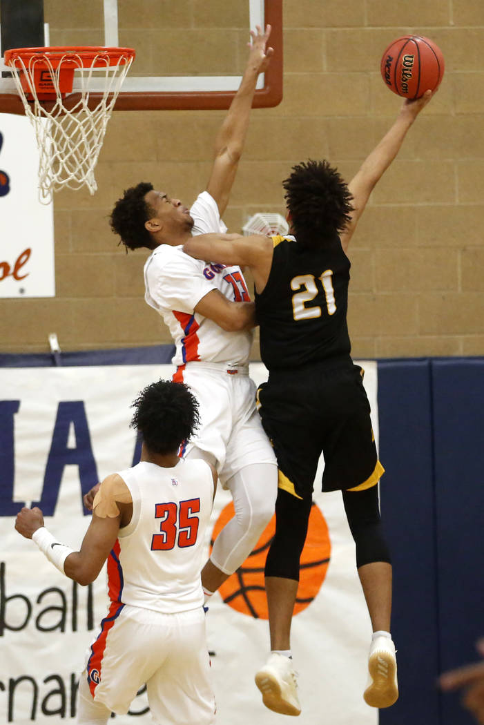 Bishop Gorman’s Jamal Bey (35) defends against Clark’s Jalen Hill (21) during th ...