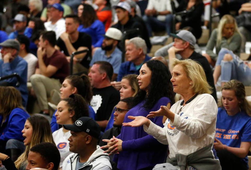 Fans react during the Sunset Region boys basketball championship at Legacy High School in No ...