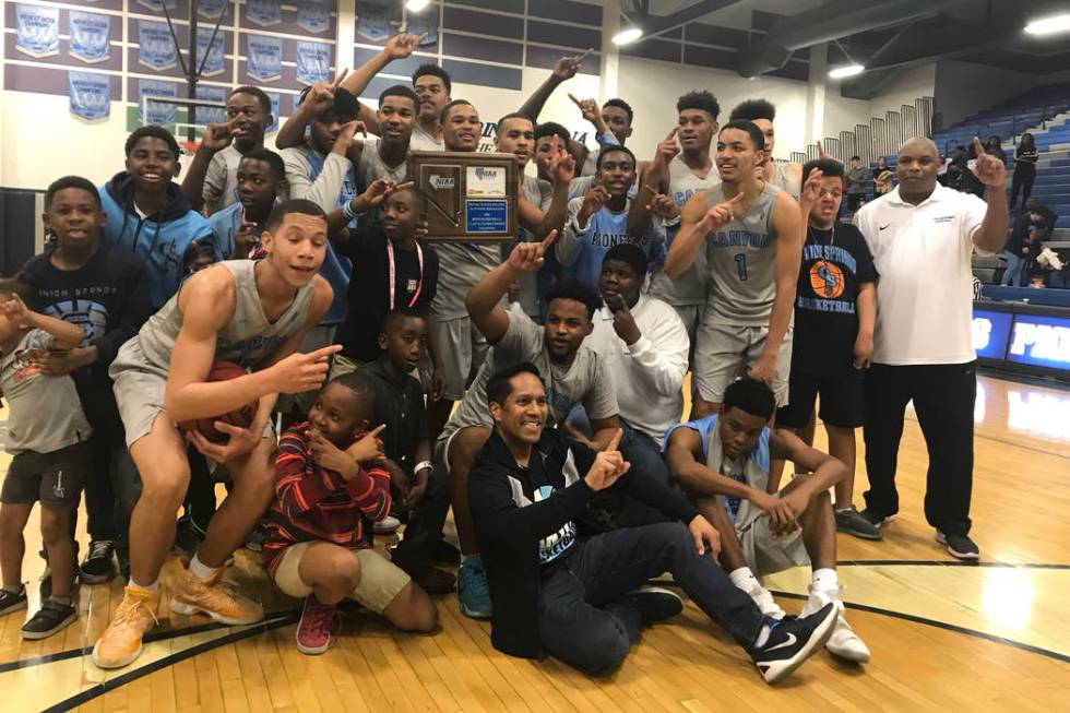 Canyon Springs players pose with the trophy after beating Coronado for the Class 4A Sunrise ...