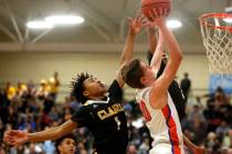 Bishop Gorman’s Noah Taitz (20) shoots against Clark’s Frankie Collins (1) duri ...