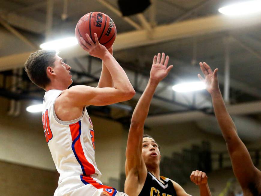 Bishop Gorman’s Noah Taitz (20) shoots against Clark’s Ian Alexander (32) durin ...