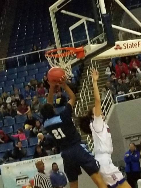 Centennial’s Justice Ethridge drives for a basket against Reno on Thursday, Feb. 22, 2 ...