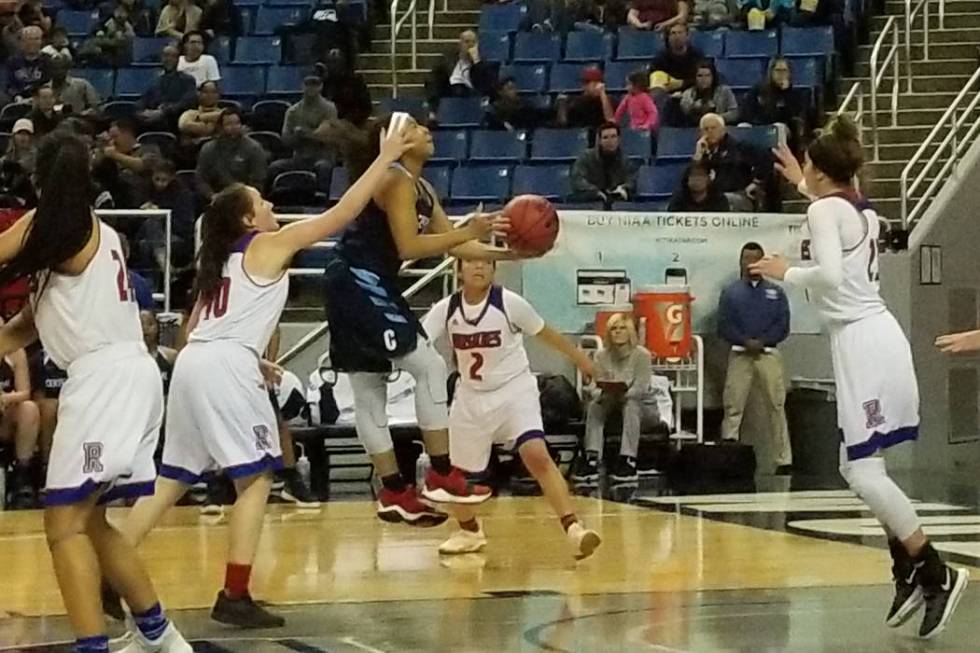 Centennial’s Ajanhai Phoumiphat drives to the basket against Reno on Thursday, Feb. 22 ...