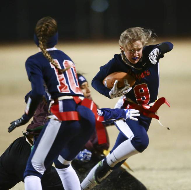 Coronado’s Ashley Taibi (8) tries to avoid getting tagged by Shadow Ridge as Coronado& ...