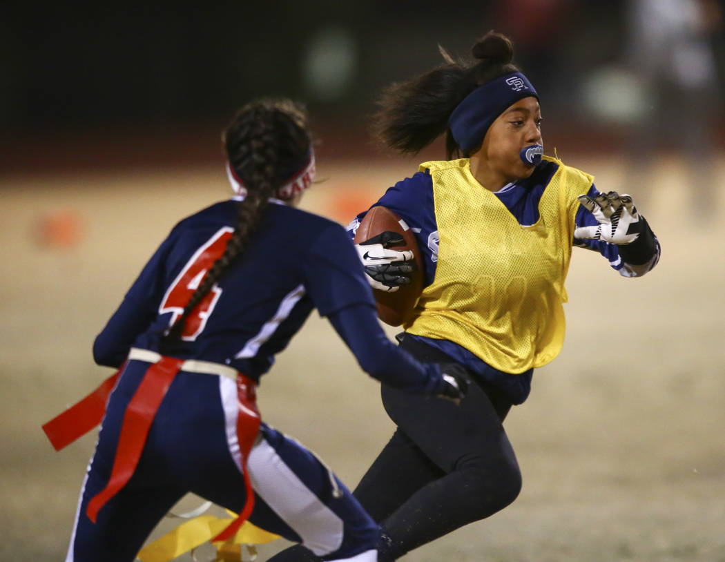 Shadow Ridge’s Jordan Ford (11) drives past Coronado’s Lexie Potts (4) during th ...