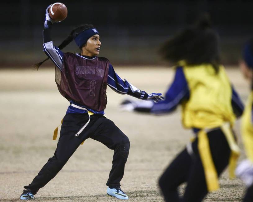 Shadow Ridge’s Dayvian Diaz (1) looks to throw a pass during the Class 4A state flag f ...