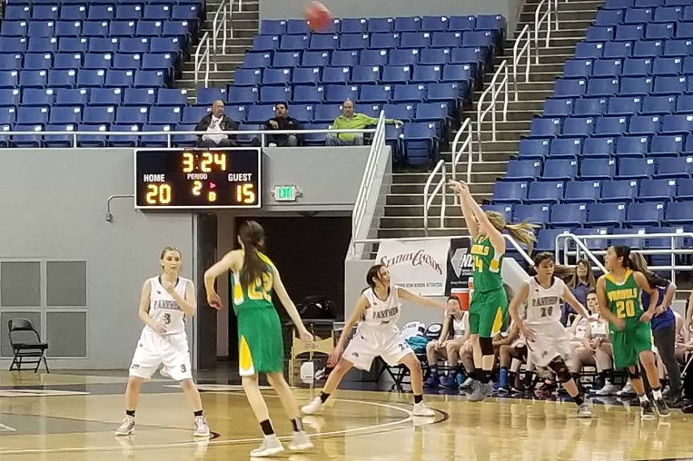 Eureka’s Cody Gibbs fires a 3-pointer over Pahranagat Valley’s Karley Whipple on ...