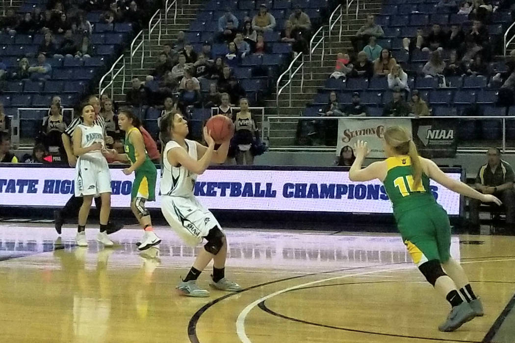 Pahranagat Valley’s Morgan Harris pulls up for a 3-pointer as Eureka’s Cody Gibb ...