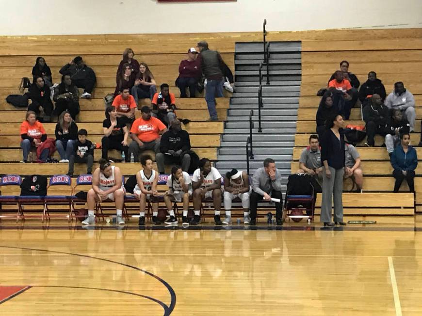 Mojave players watch from the bench in the second half of the Rattlers’ 73-38 loss to ...