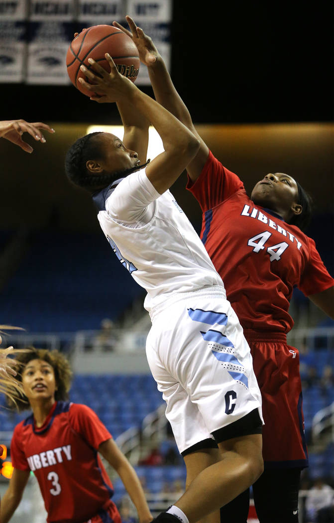 Centennial’s Justice Ethridge tries to shoot past Liberty’s Dre’una Edward ...