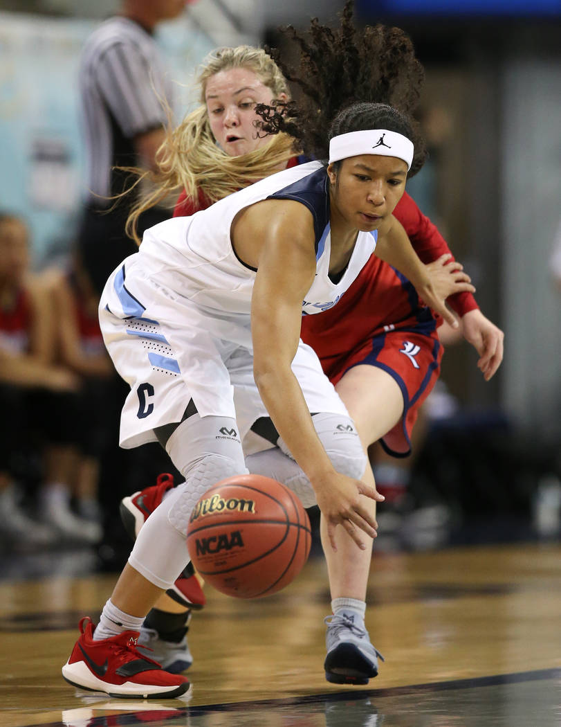 Liberty’s London Pavlica and Centennial’s Ajanhjai Phoumiphat fight for a loose ...