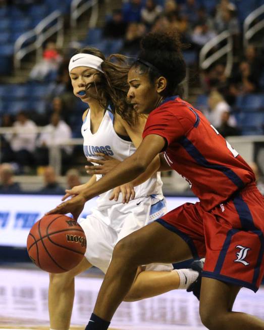 Liberty’s Trinity Vasquez dribbles around Centennial defender Melanie Isbell during th ...