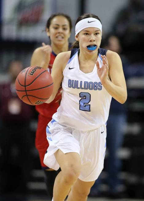 Centennial’s Jade Thomas competes against Liberty in the NIAA state basketball tournam ...