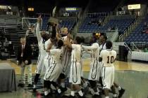 Spring Mountain players celebrate after winning beating Mineral County 50-36 for the Class 1 ...