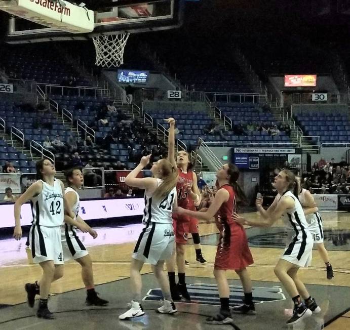 Lincoln County’s Kailey Kelley takes a shot in traffic against White Pine in the Class ...