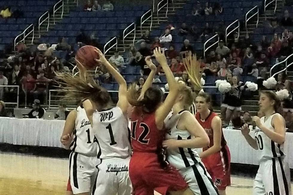 White Pine’s Lily Fulmer battles for a rebound with Lincoln County’s Kylee Camer ...