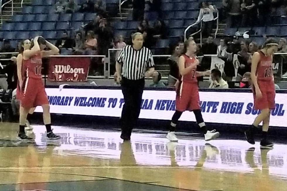 Lincoln County players react after losing 44-39 in overtime to White Pine in the Class 2A gi ...