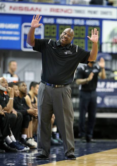 Desert Pines head coach Teral Fair talks to an official in the NIAA 3A state basketball cham ...