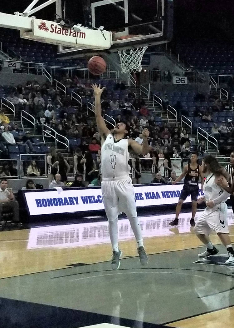 Battle Mountain’s Christian Figueroa pulls down a rebound against Democracy Prep at La ...